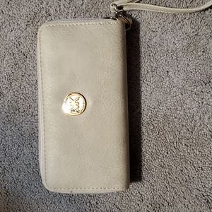 2 NON AUTHENTIC MK wallets. Cute good for a child